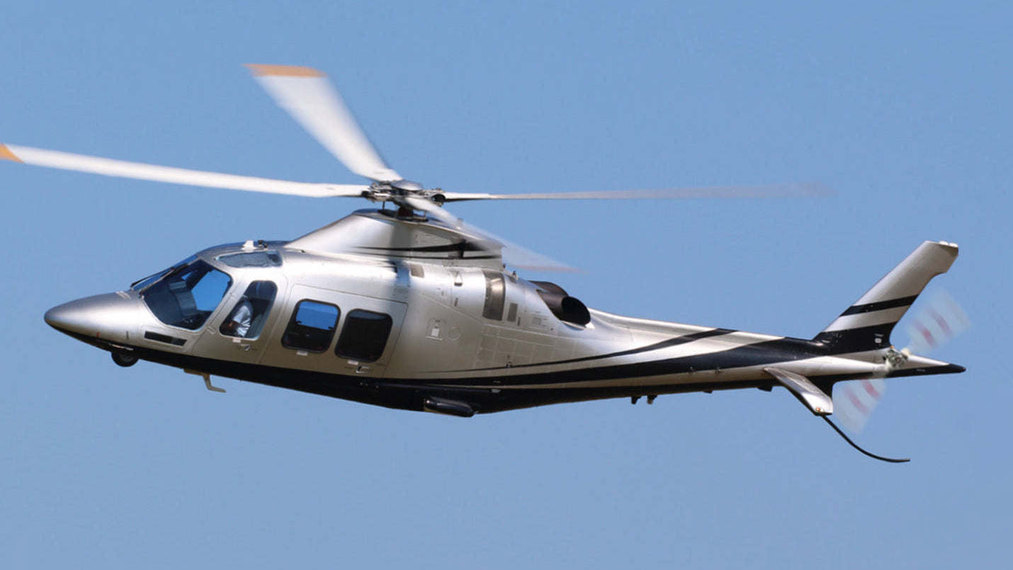 Helicopter flying against a clear blue sky